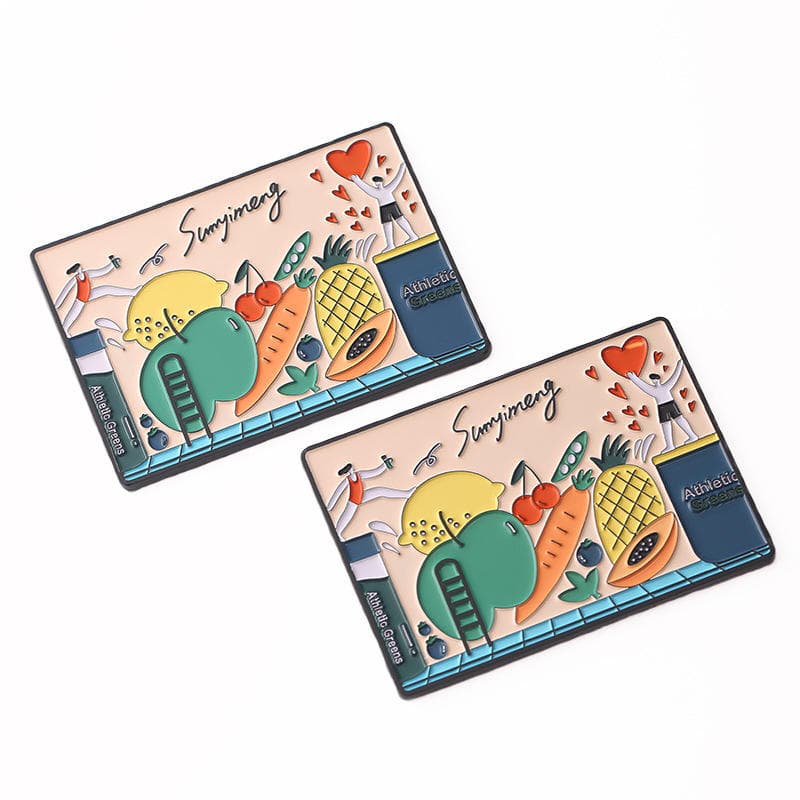 Pair of rectangular enamel fridge magnets with colourful fruit illustrations
