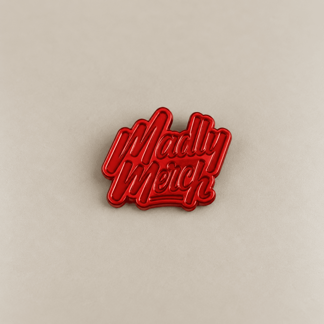 Red dyed plated metal wordmark sample.