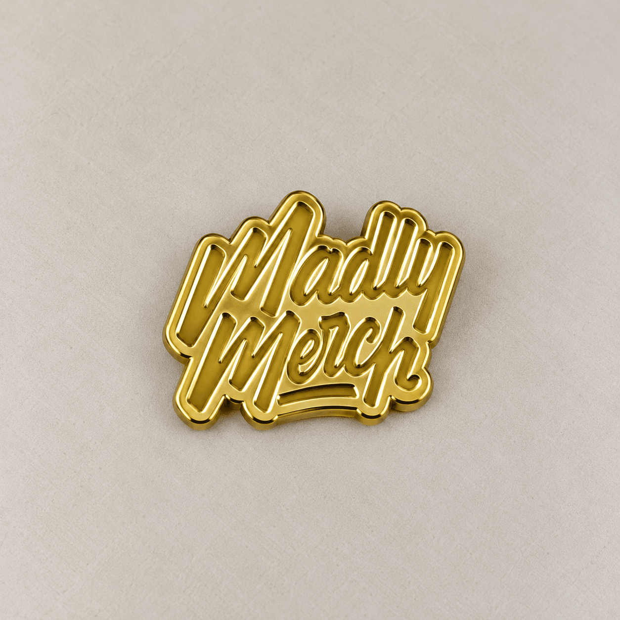 Gold-toned plated metal wordmark sample.