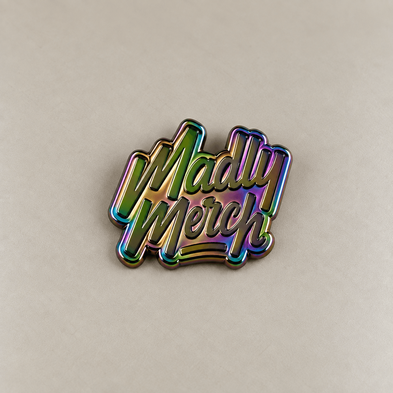 Rainbow plated metal wordmark sample.