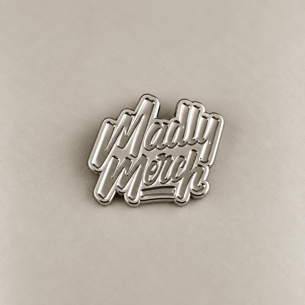 Silver-toned plated metal wordmark sample.