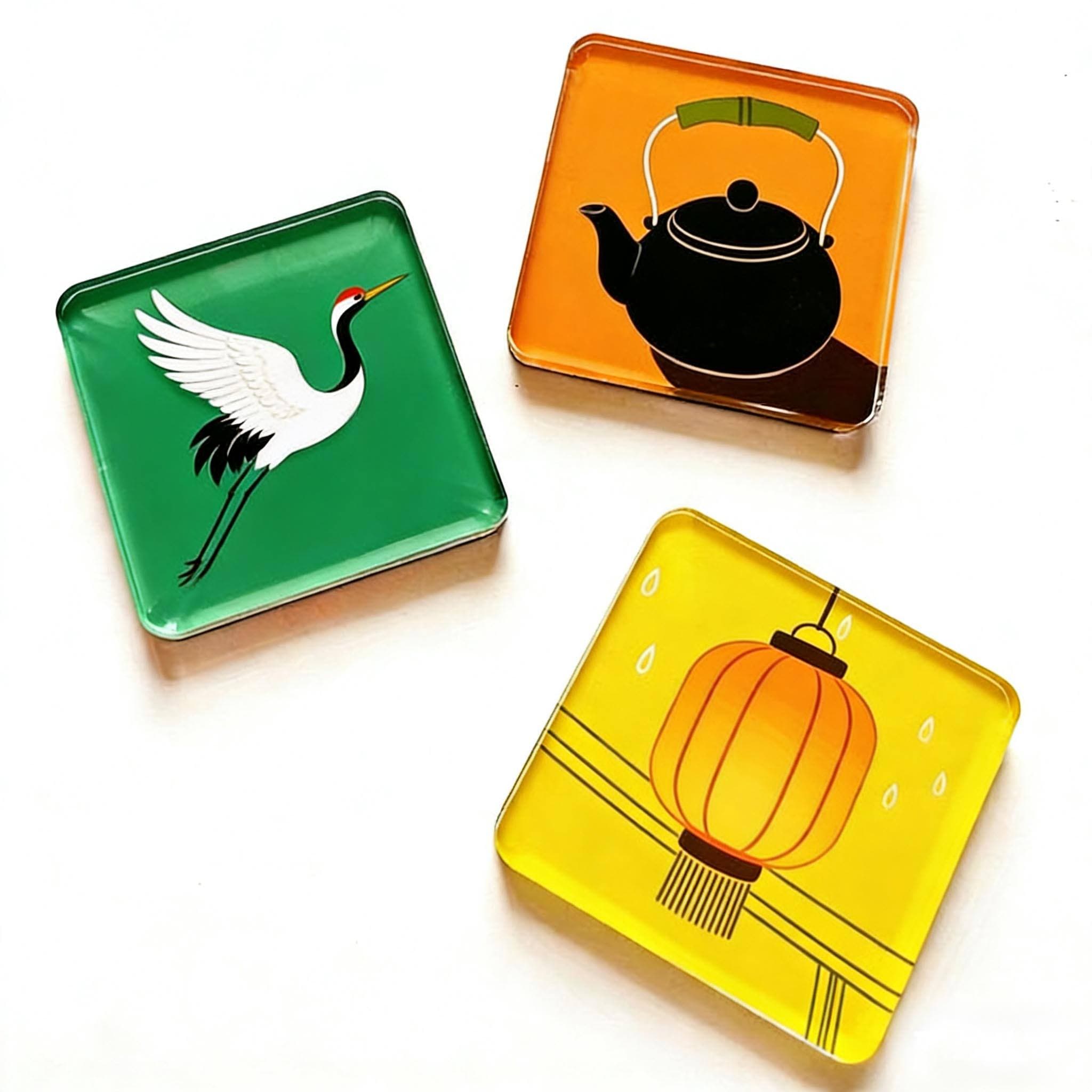 Custom acrylic fridge magnets with bird, teapot and lantern artwork
