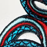 Close-up of a hot cut chenille patch border