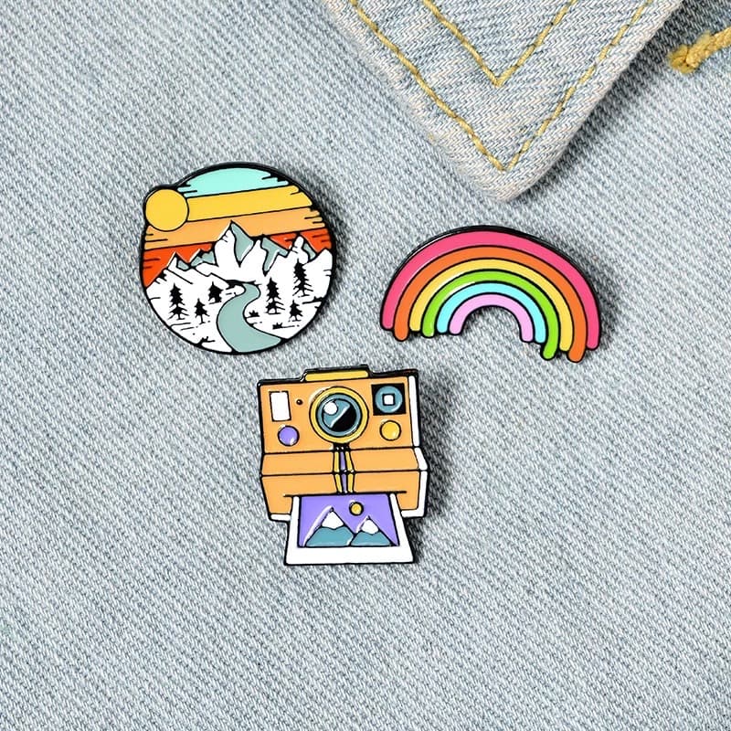 Soft enamel pin badges from the live page: colourful custom badges