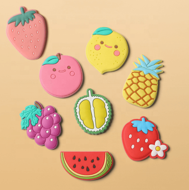Collection of colourful fruit-shaped PVC fridge magnets