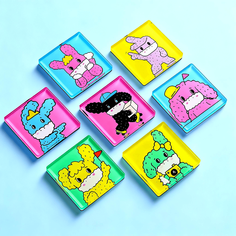 Collection of colourful puppy-shaped acrylic fridge magnets