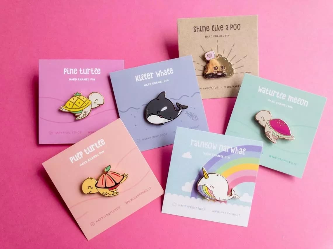 Hard enamel pin badges from the live page: group of custom badges