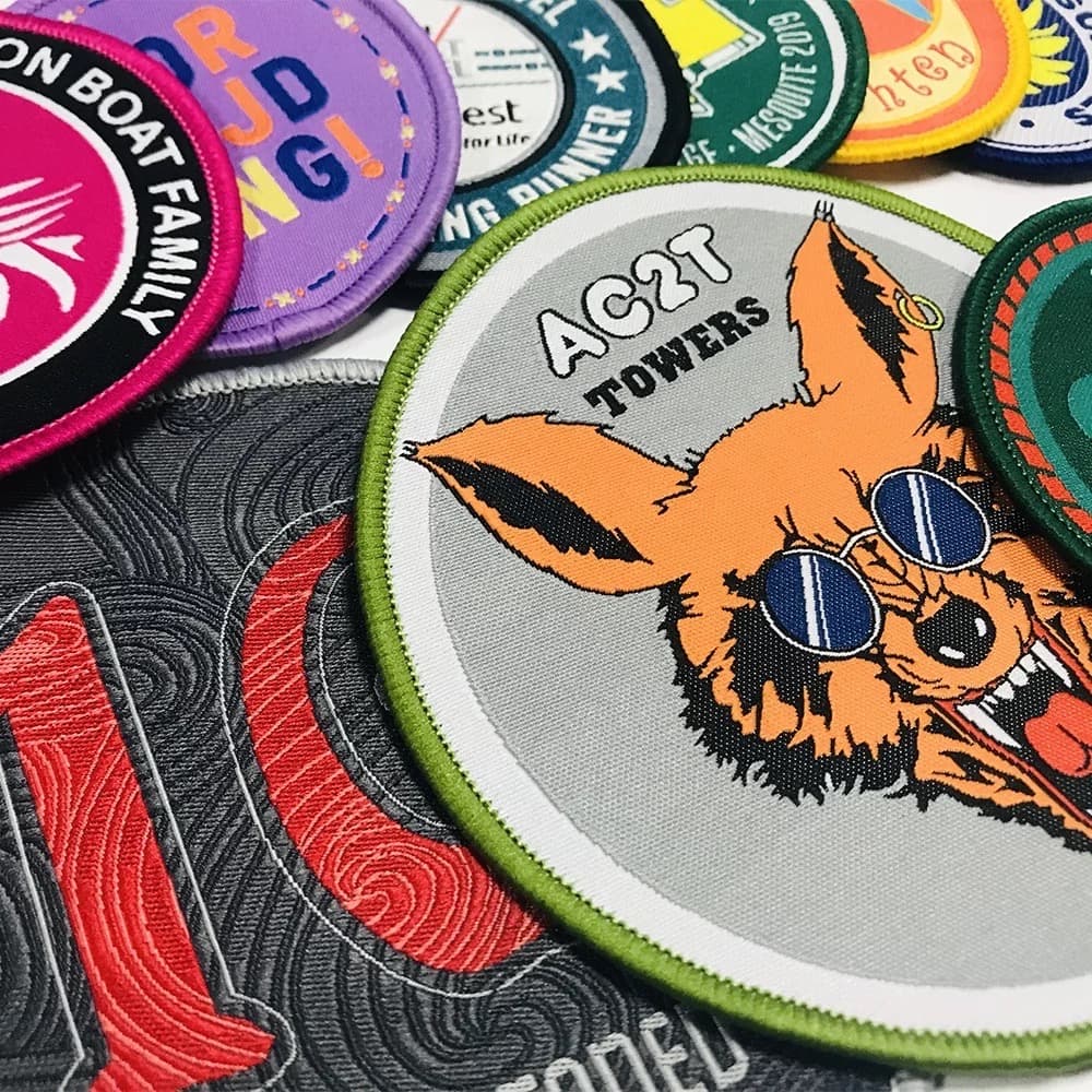 Woven patches from the live Custom Woven Patches page: group of custom patches