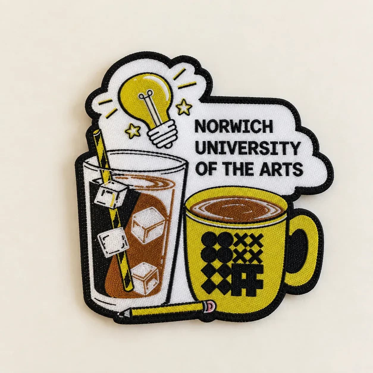 Woven Norwich University of the Arts patch with lettering, a lightbulb and illustrated drinks